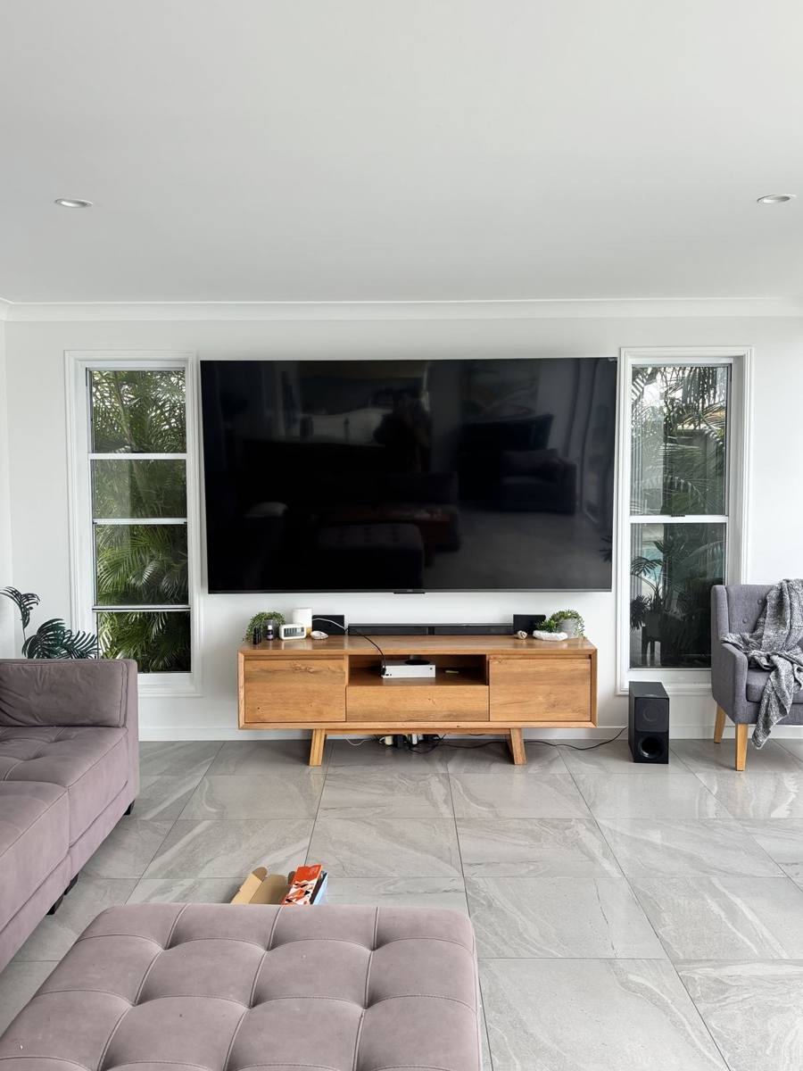 TV mounted above timber console